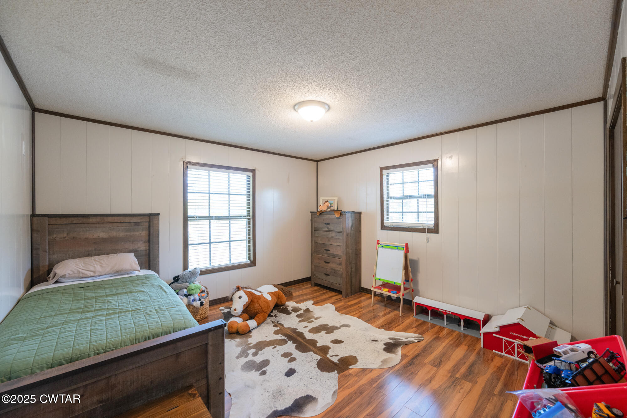 1176 Myracle Town Road Darden, TN 38328 - Photo 28 of 40 a bedroom with a bed and a window