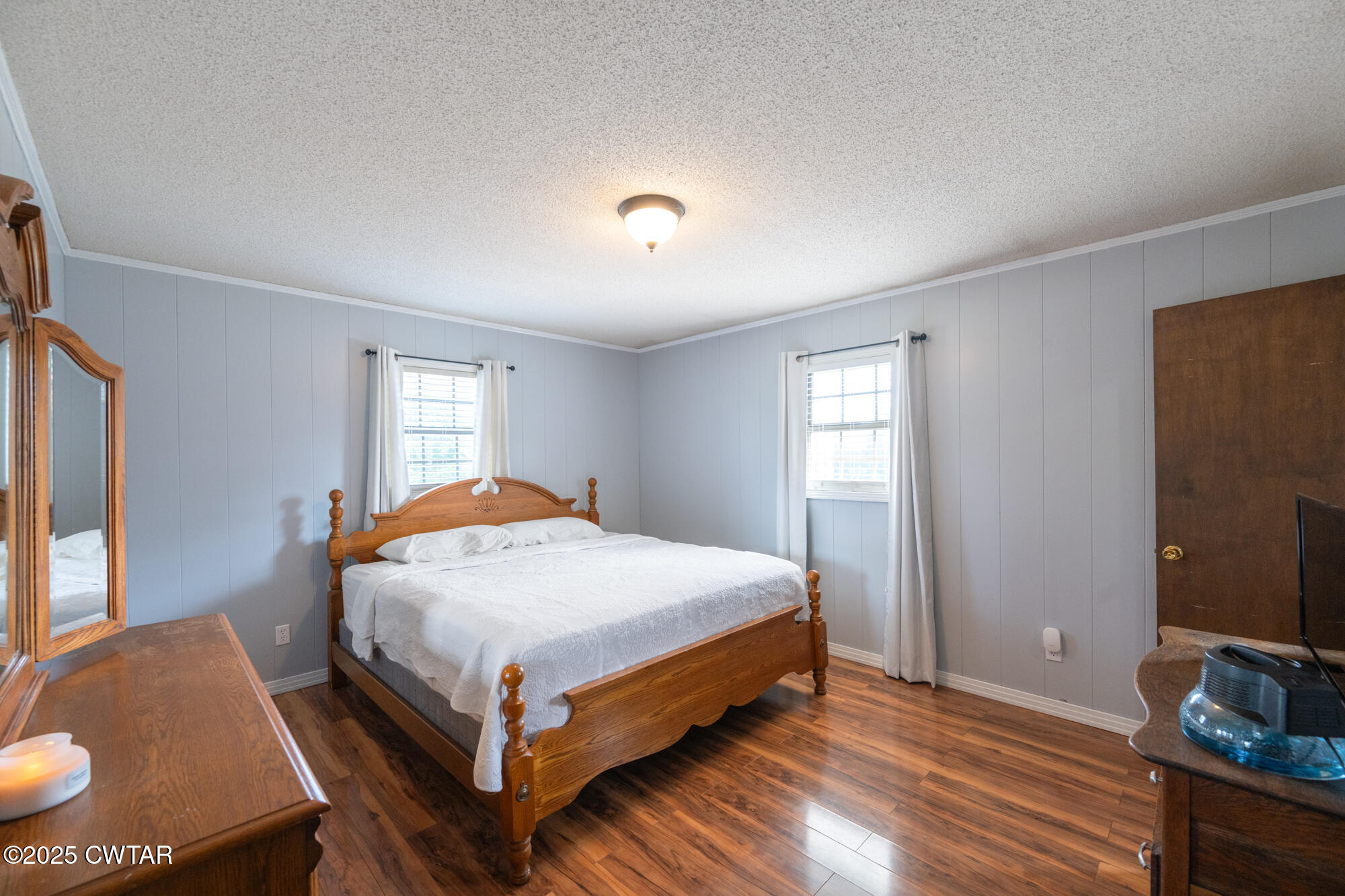 1176 Myracle Town Road Darden, TN 38328 - Photo 29 of 40 a bed sitting in a bedroom next to a window