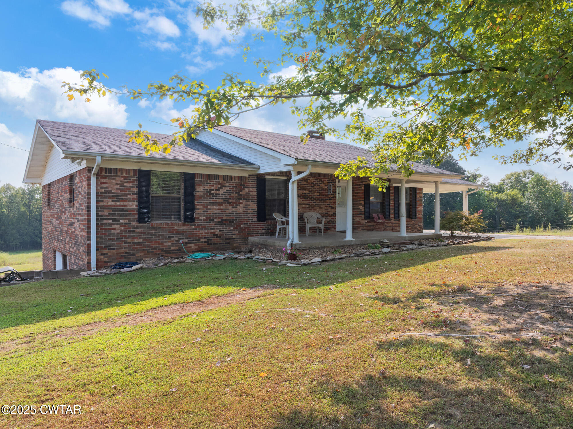 1176 Myracle Town Road Darden, TN 38328 - Photo 3 of 40 a view of a house with swimming pool