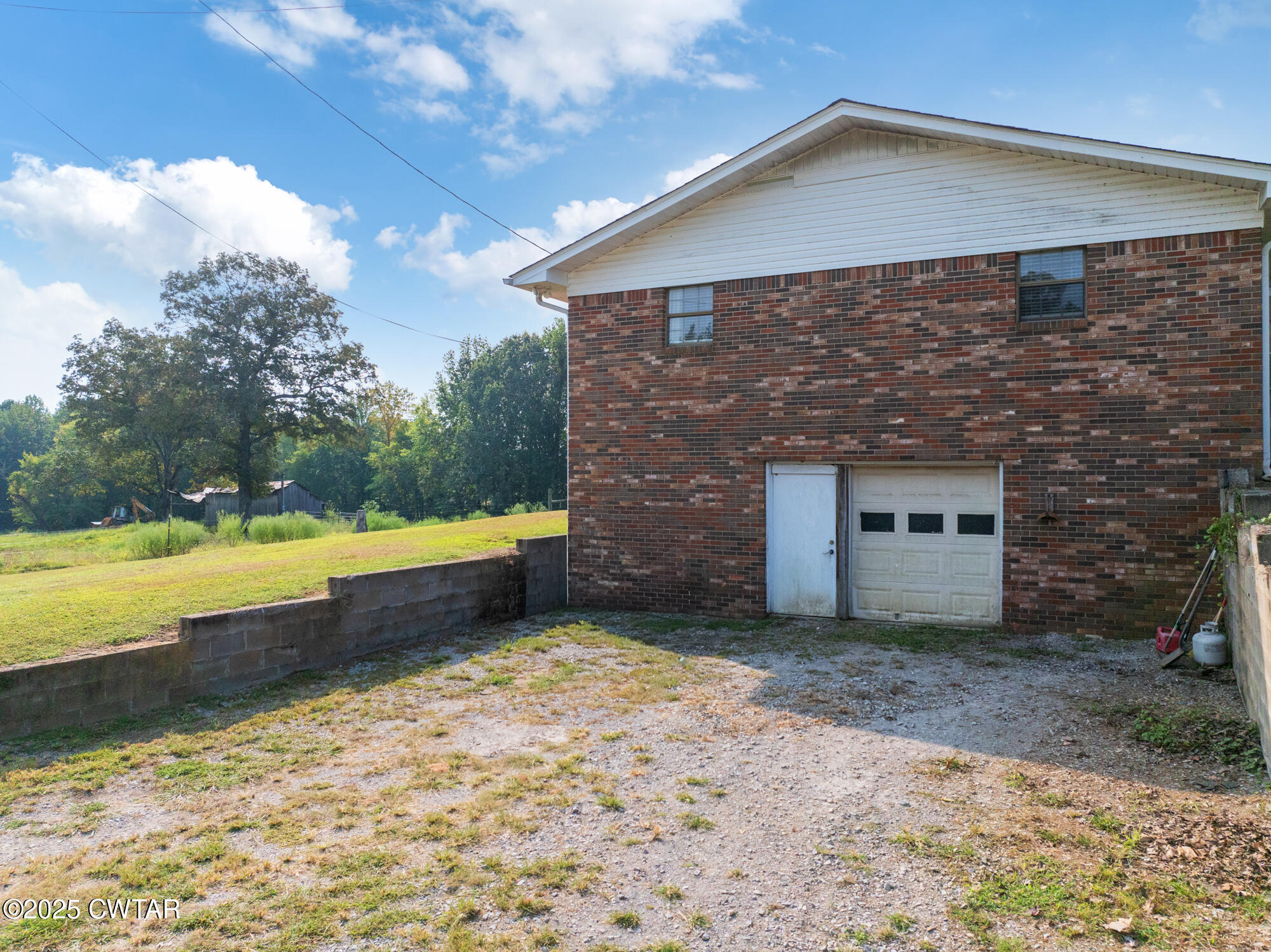 1176 Myracle Town Road Darden, TN 38328 - Photo 6 of 40 a front view of a house with a yard