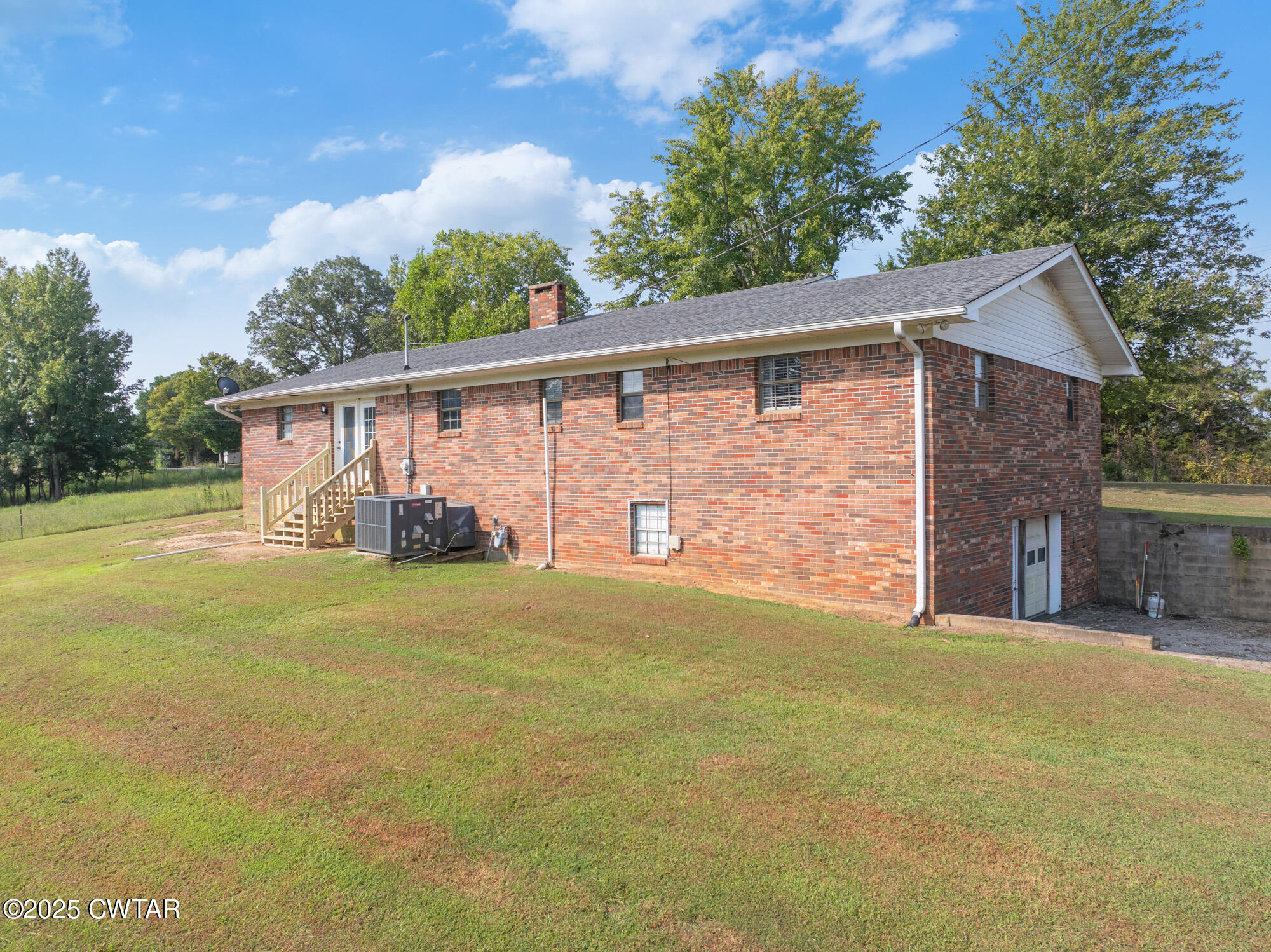 1176 Myracle Town Road Darden, TN 38328 - Photo 7 of 40 a front view of a house with garden
