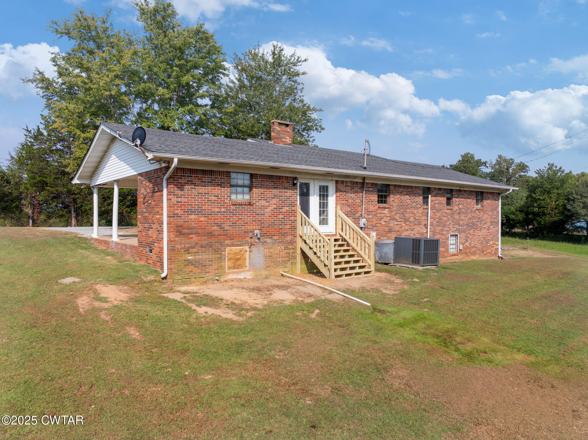 1176 Myracle Town Road Darden, TN 38328 - Photo 8 of 40 a view of a house with backyard and garden