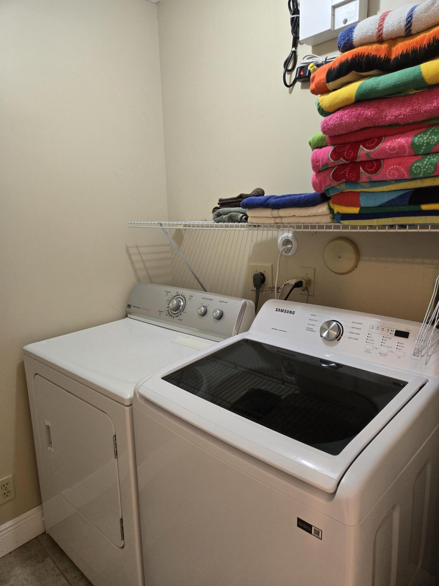 8081 Springtree Road, Unit C Boca Raton, FL 33496 - Photo 19 of 31 a utility room with dryer and washer