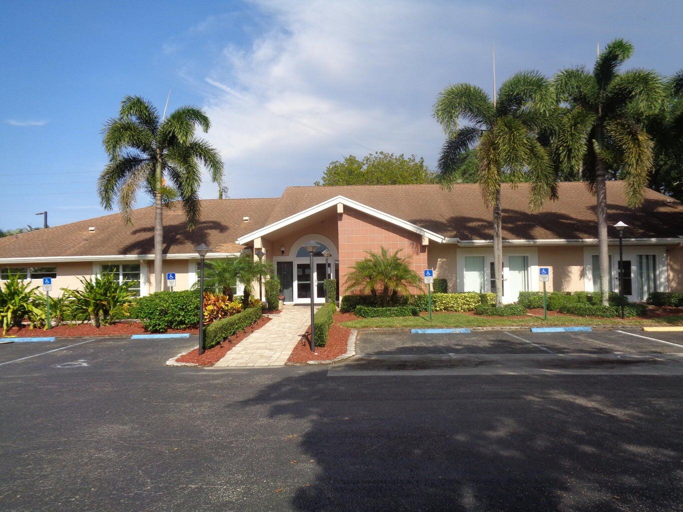 8081 Springtree Road, Unit C Boca Raton, FL 33496 - Photo 26 of 31 a view of a street with palm trees