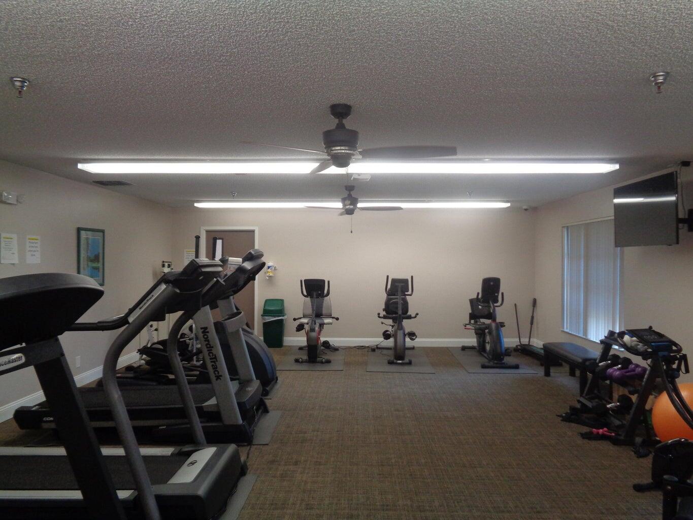8081 Springtree Road, Unit C Boca Raton, FL 33496 - Photo 31 of 31 a view of a room with gym equipment