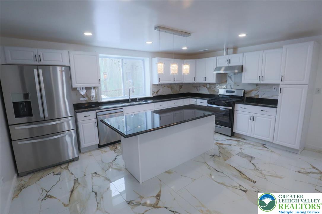 2270 Easton Road Bethlehem, PA 18015 - Photo 16 of 43 a kitchen with granite countertop a sink stainless steel appliances and cabinets