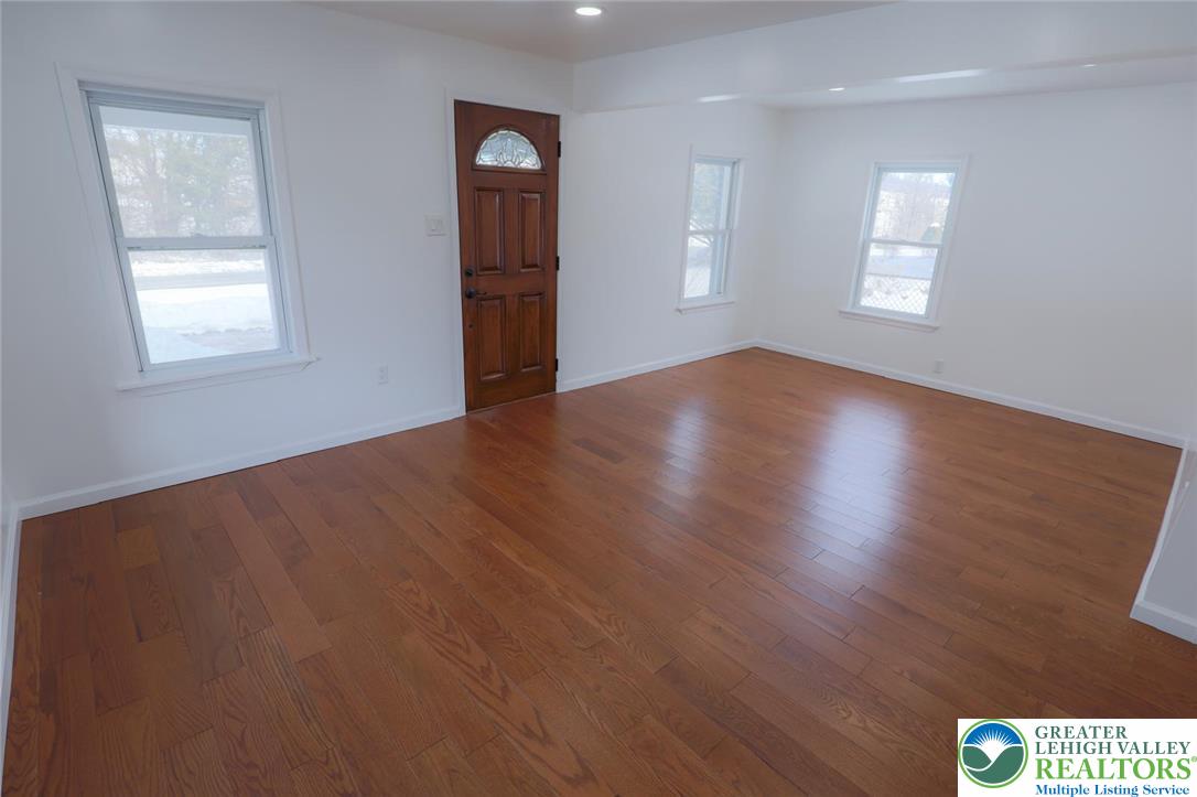2270 Easton Road Bethlehem, PA 18015 - Photo 18 of 43 an empty room with wooden floor and windows