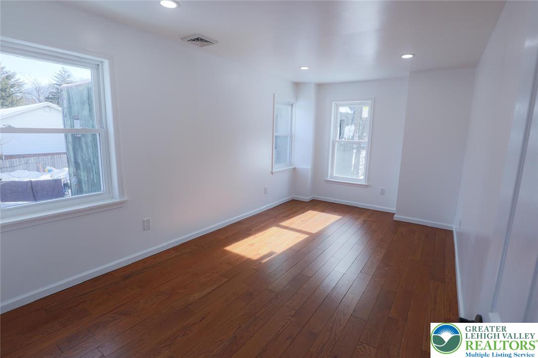 2270 Easton Road Bethlehem, PA 18015 - Photo 28 of 43 an empty room with wooden floor and windows