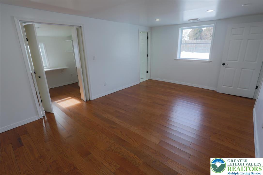 2270 Easton Road Bethlehem, PA 18015 - Photo 6 of 43 an empty room with wooden floor and windows