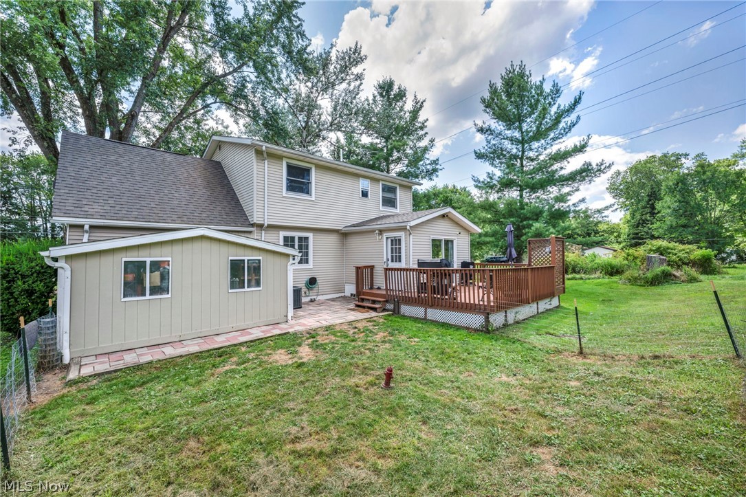 3005 Kendall Road Akron, OH 44321 - Photo 36 of 46 Rear view of house with a wooden deck and a lawn