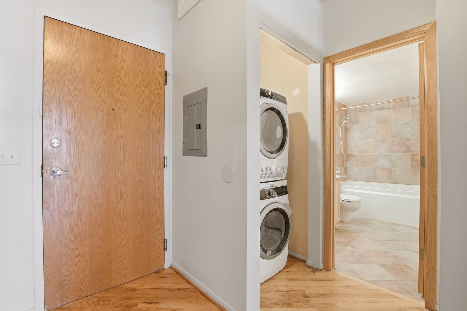 1250 West Van Buren Street, Unit 313 Chicago, IL 60607 - Photo 12 of 16 a view of a hallway with washer and dryer