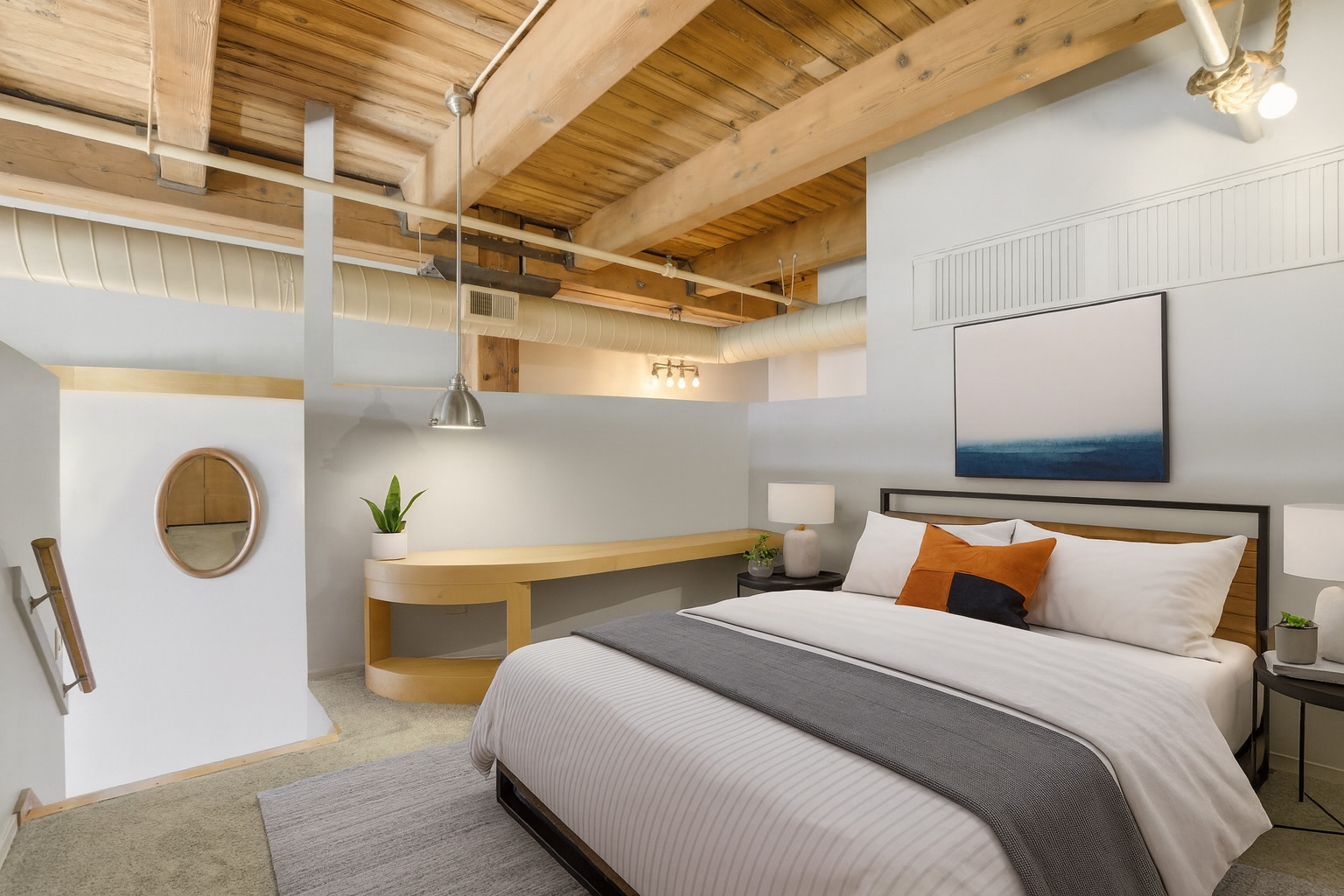 1250 West Van Buren Street, Unit 313 Chicago, IL 60607 - Photo 8 of 16 a bedroom with a bed and a lamp on the dresser