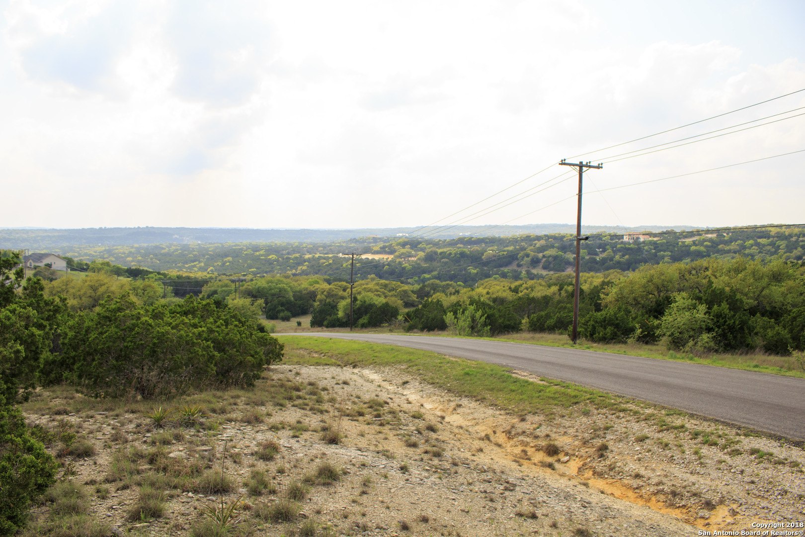 110 Peppergrass Drive Spring Branch, TX 78070 - Photo 5 of 9 a view of a road with a yard