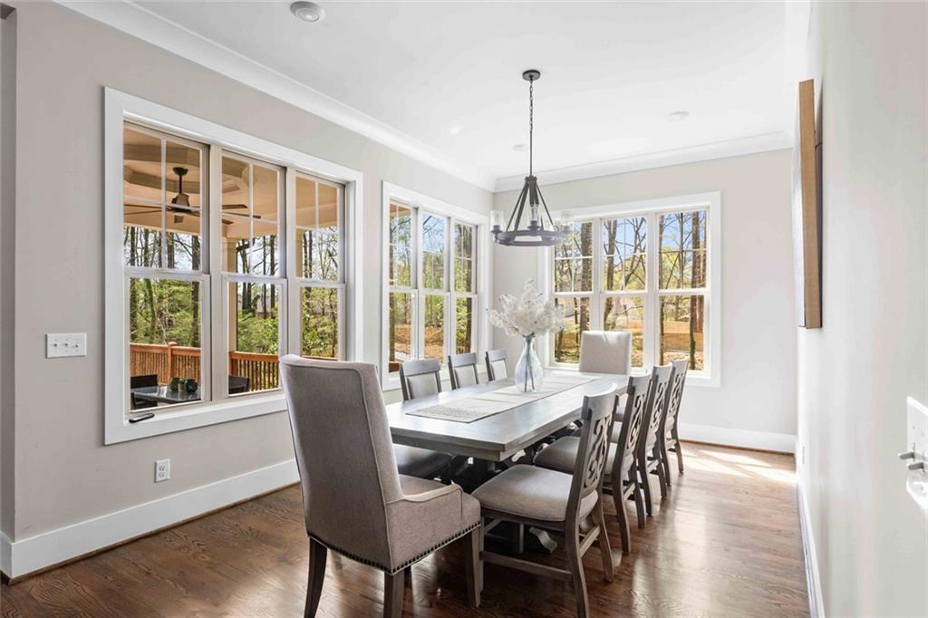5758 Williams Road Norcross, GA 30093 - Photo 14 of 90 a view of a dining room with furniture window and wooden floor