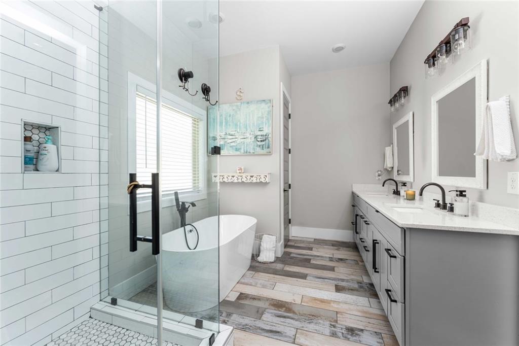 5758 Williams Road Norcross, GA 30093 - Photo 26 of 90 a bathroom with a bathtub and a sink