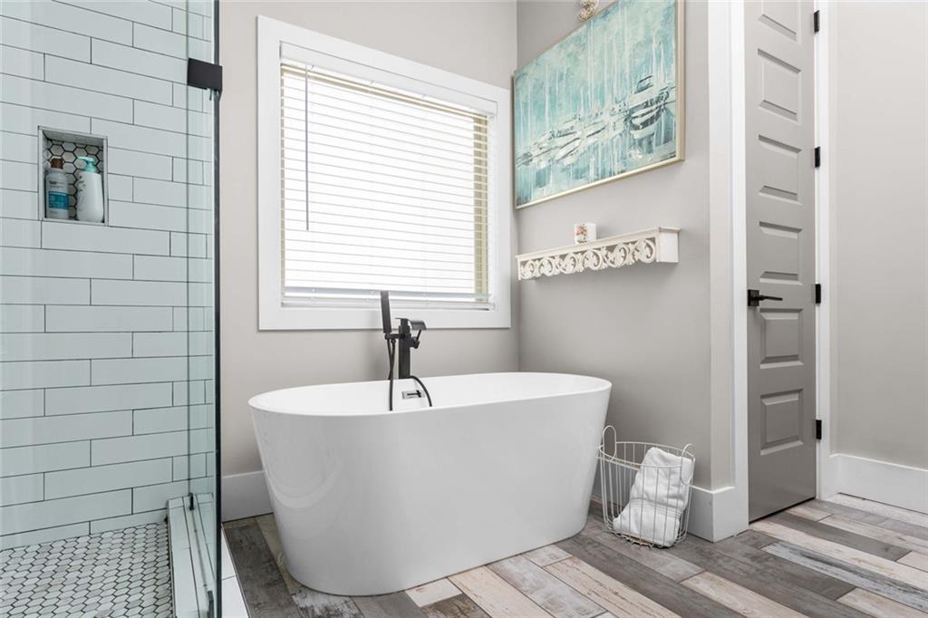 5758 Williams Road Norcross, GA 30093 - Photo 27 of 90 a white tub sitting next to a window