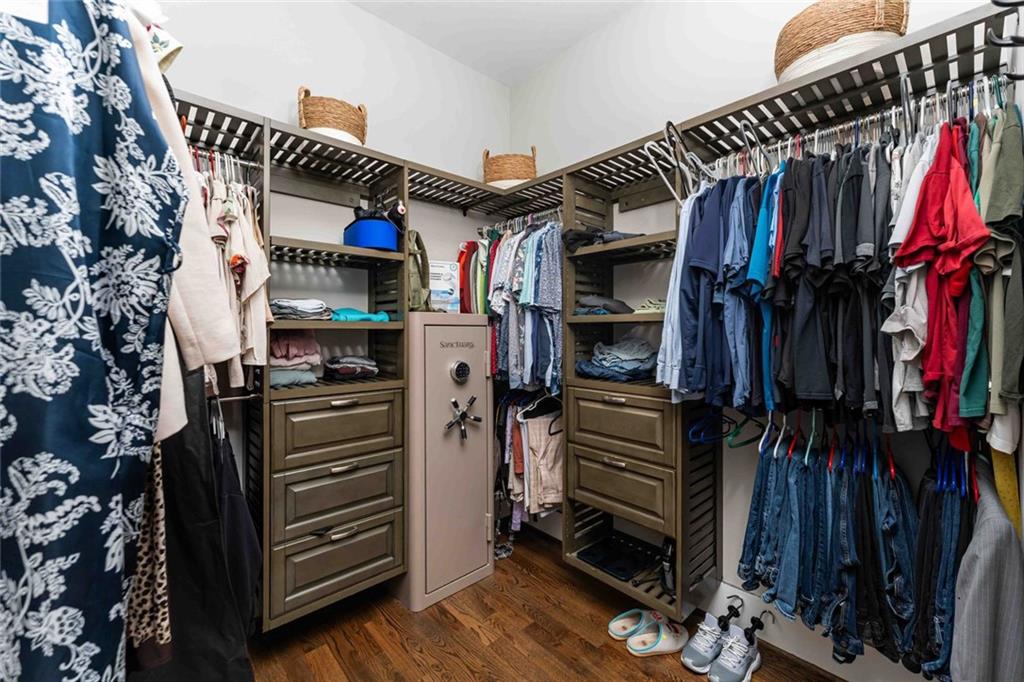5758 Williams Road Norcross, GA 30093 - Photo 30 of 90 a view of walk in closet with clothes and shoes