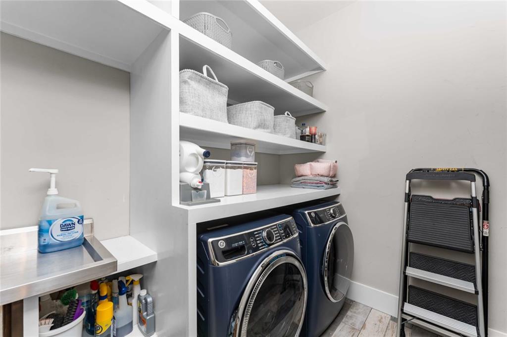 5758 Williams Road Norcross, GA 30093 - Photo 35 of 90 a utility room with dryer and washer