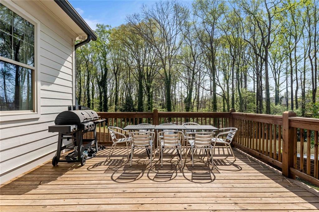5758 Williams Road Norcross, GA 30093 - Photo 38 of 90 a view of a chairs and table on the deck
