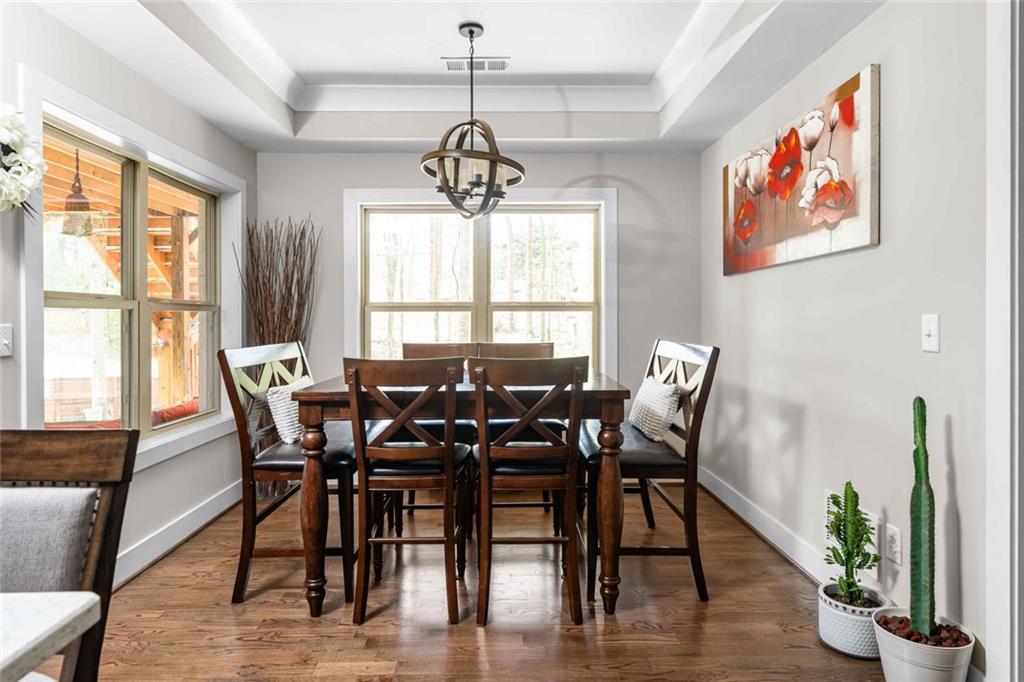 5758 Williams Road Norcross, GA 30093 - Photo 46 of 90 a view of a dining room with furniture window and wooden floor