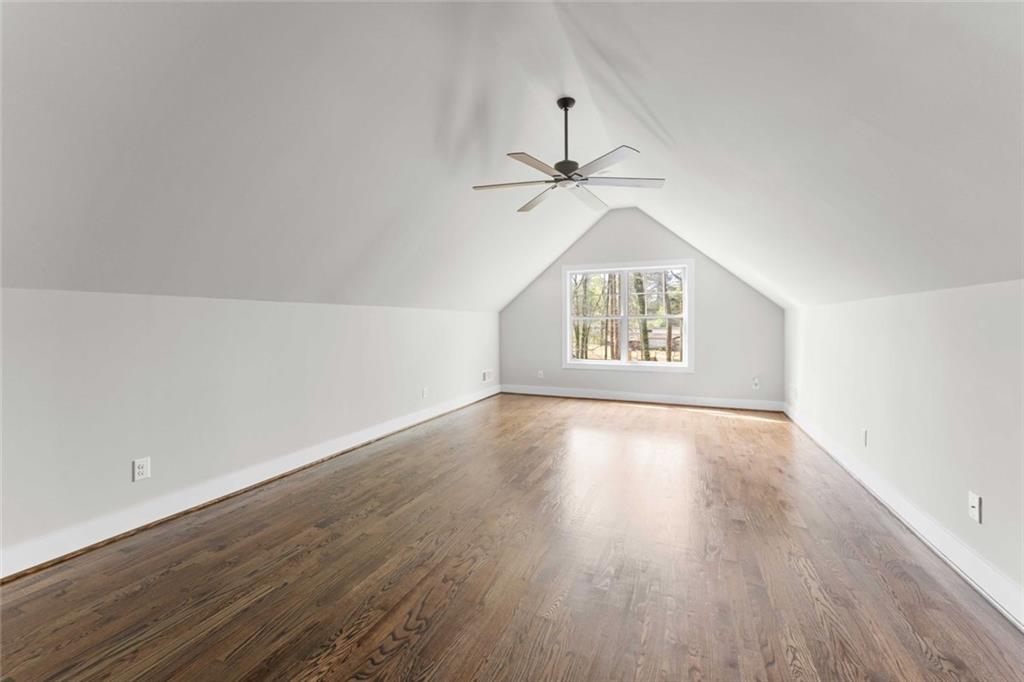 5758 Williams Road Norcross, GA 30093 - Photo 58 of 90 an empty room with wooden floor air conditioner and windows