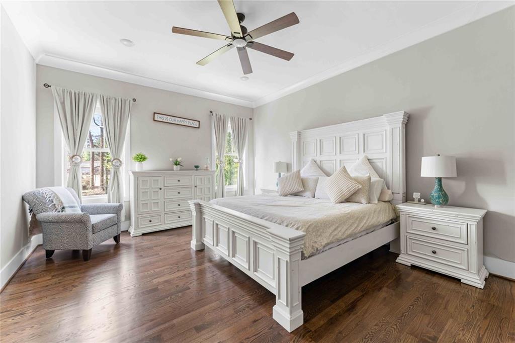 5758 Williams Road Norcross, GA 30093 - Photo 6 of 90 a bedroom with a bed and a chair