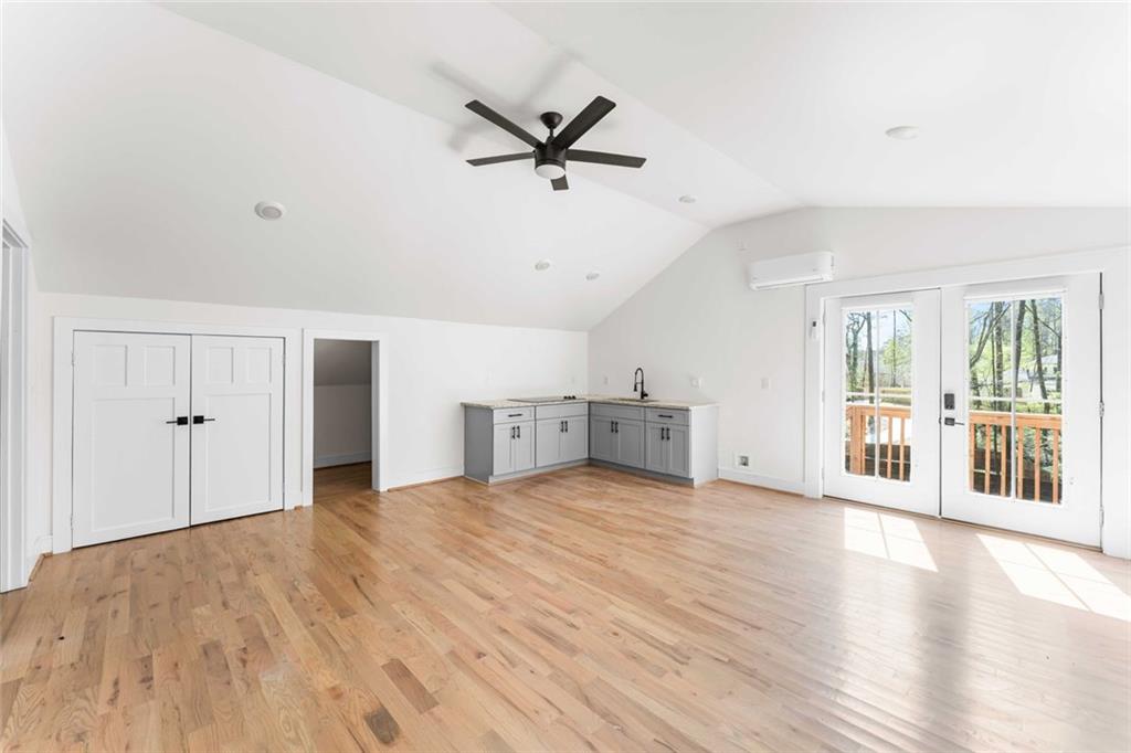5758 Williams Road Norcross, GA 30093 - Photo 61 of 90 a view of a livingroom with a ceiling fan hardwood floor and a ceiling fan