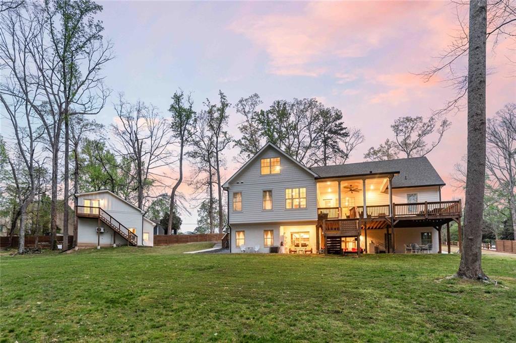 5758 Williams Road Norcross, GA 30093 - Photo 78 of 90 a front view of a house with a garden and trees