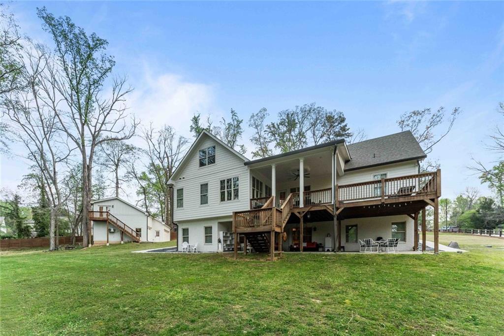 5758 Williams Road Norcross, GA 30093 - Photo 83 of 90 a view of a house with a big yard and large trees