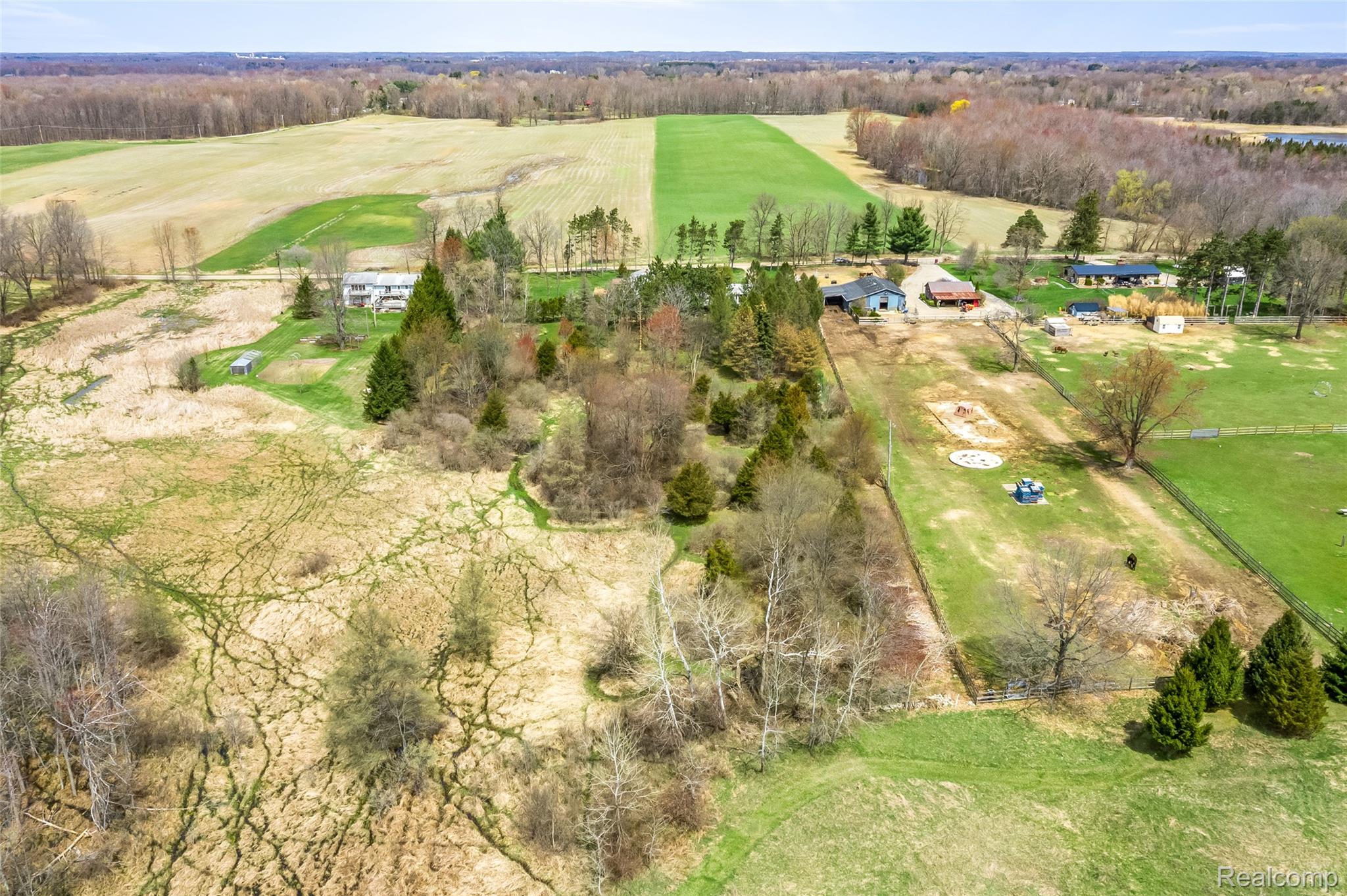 15395 Osius Road Chelsea, MI 48118 - Photo 55 of 55 Expansive acreage featuring multiple structures, cultivated fields, mature trees, and open grasslands