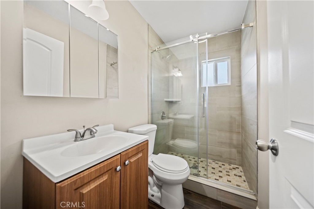 14559 Ector Street La Puente, CA 91744 - Photo 12 of 29 a bathroom with a sink toilet and shower