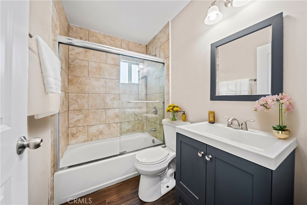 14559 Ector Street La Puente, CA 91744 - Photo 14 of 29 a bathroom with a sink a toilet and shower