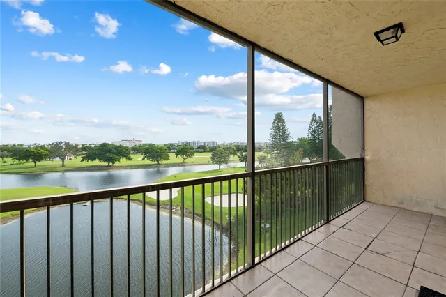 a view of a balcony with lake from balcony