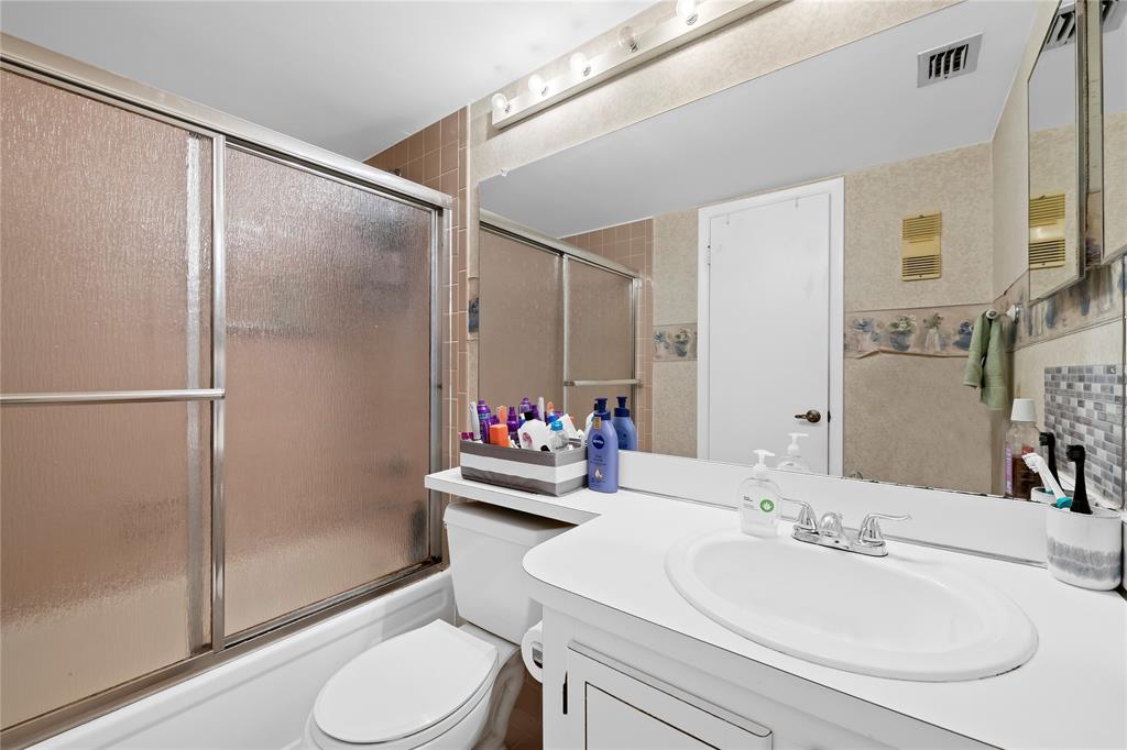 3150 West Rolling Hills Circle, Unit 603 Davie, FL 33328 - Photo 11 of 23 a bathroom with a sink toilet and shower