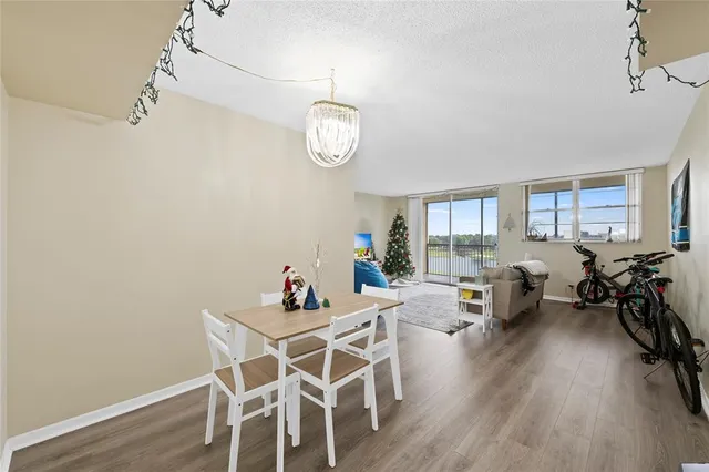 a view of a dining room with furniture wooden floor and a rug