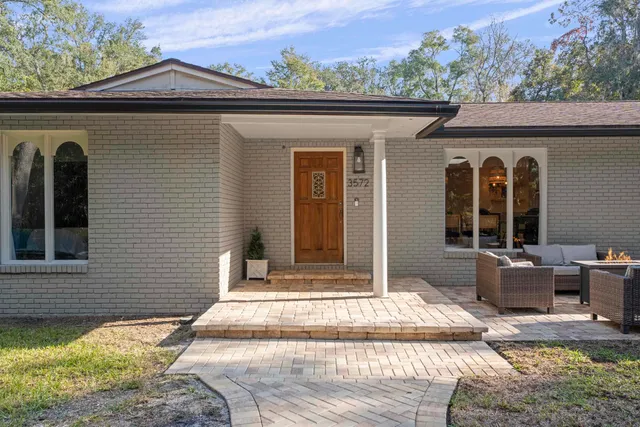 a front view of a house with a porch