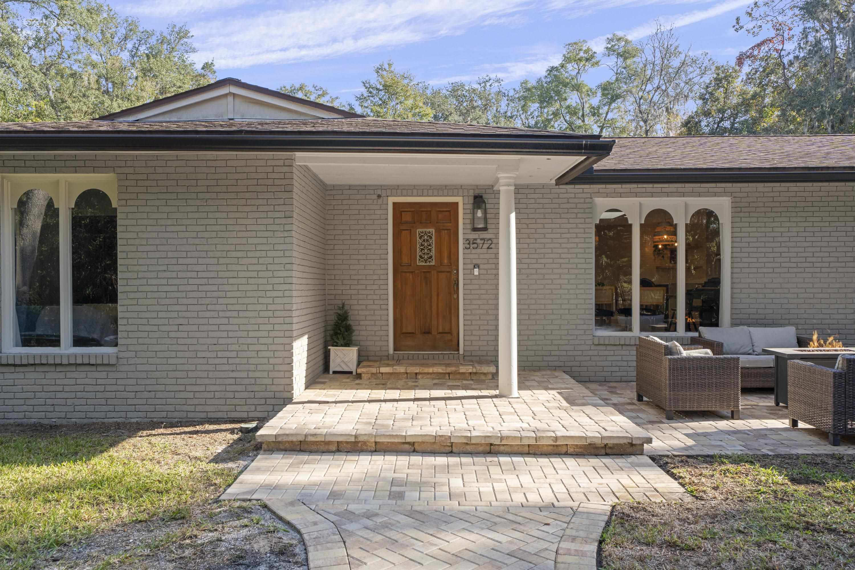 a front view of a house with a porch
