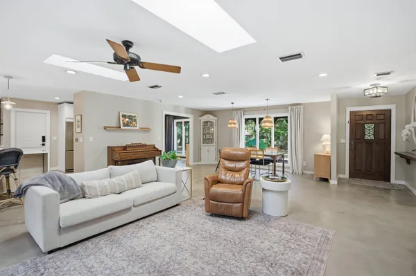 a living room with furniture fireplace and a flat screen tv