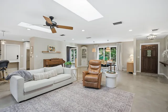 a living room with furniture fireplace and a flat screen tv
