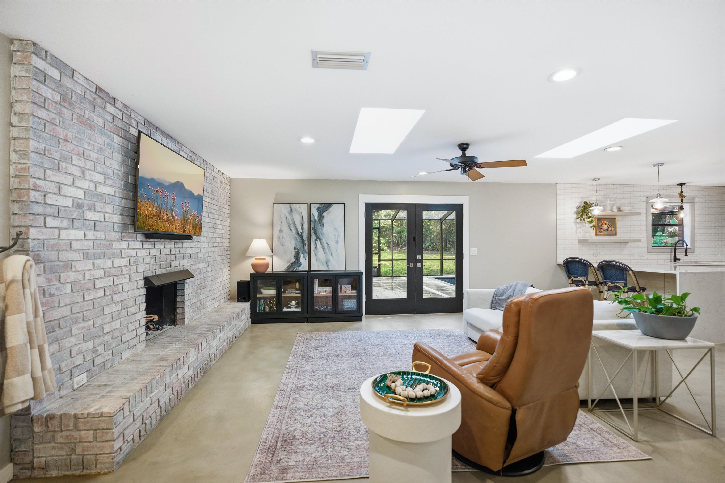 3572 Red Cloud Trail St. Augustine, FL 32086 - Photo 16 of 74 a living room with furniture fireplace and a flat screen tv