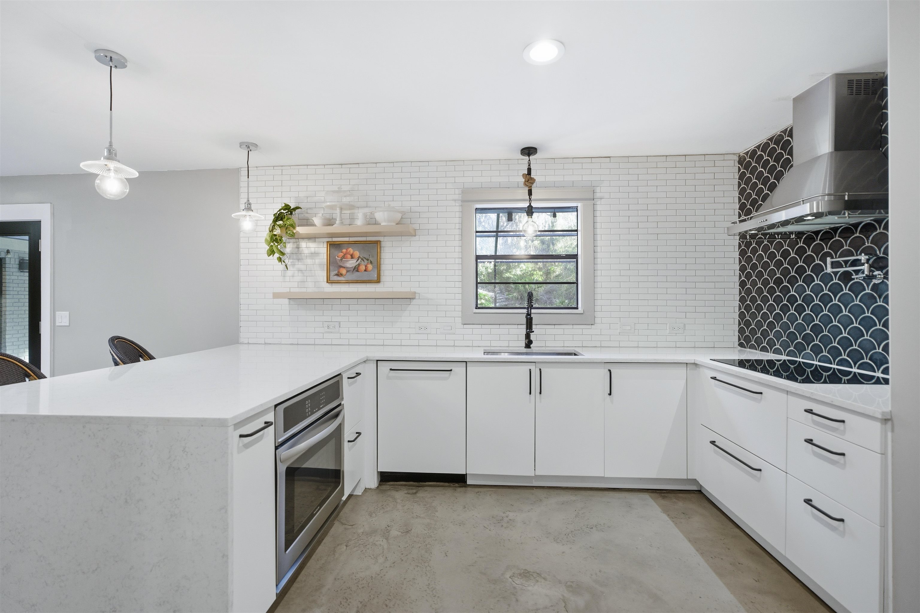 3572 Red Cloud Trail St. Augustine, FL 32086 - Photo 20 of 74 a kitchen with a sink stove and microwave