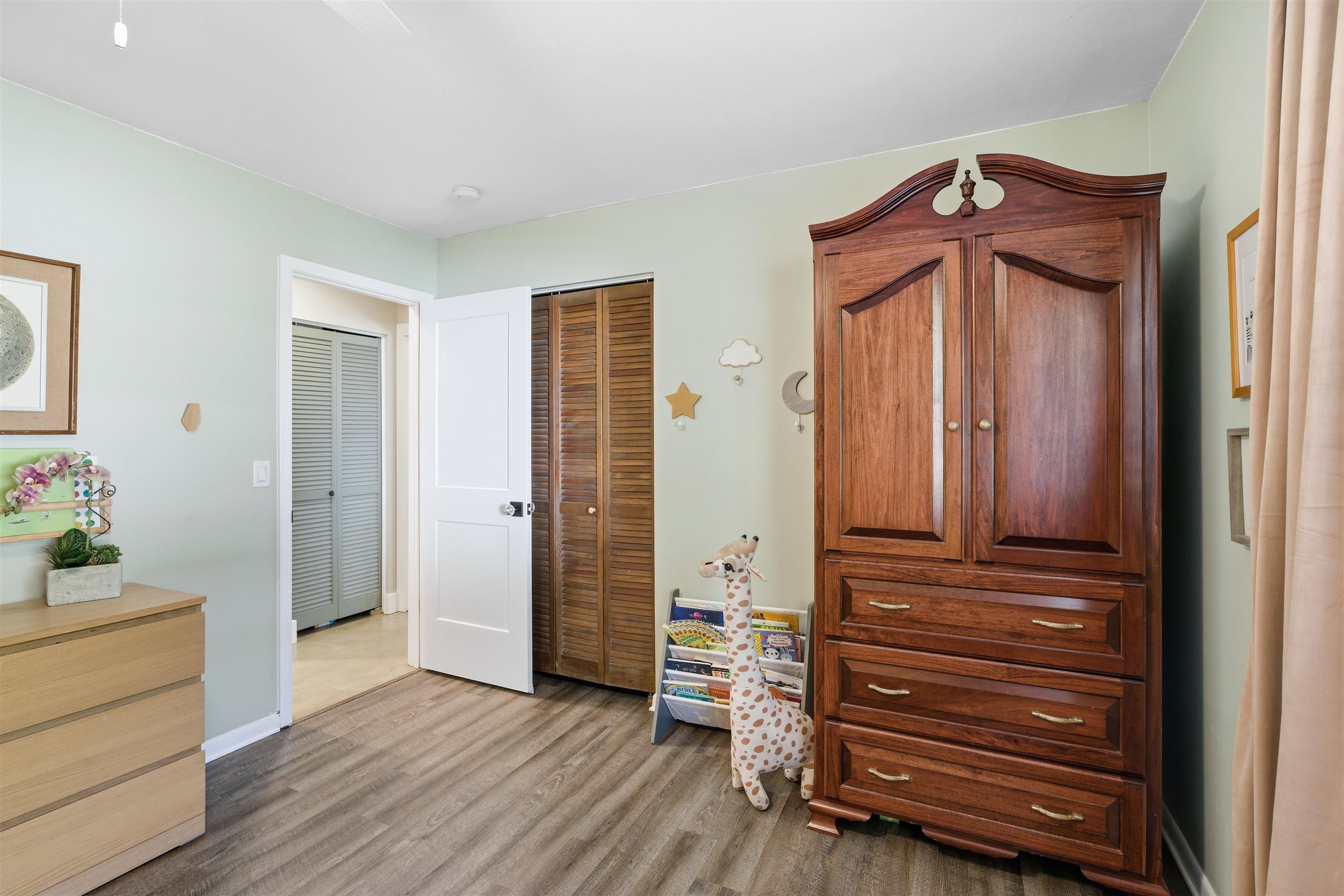 3572 Red Cloud Trail St. Augustine, FL 32086 - Photo 33 of 74 Bedroom with ceiling fan, dark wood-style flooring, and a closet