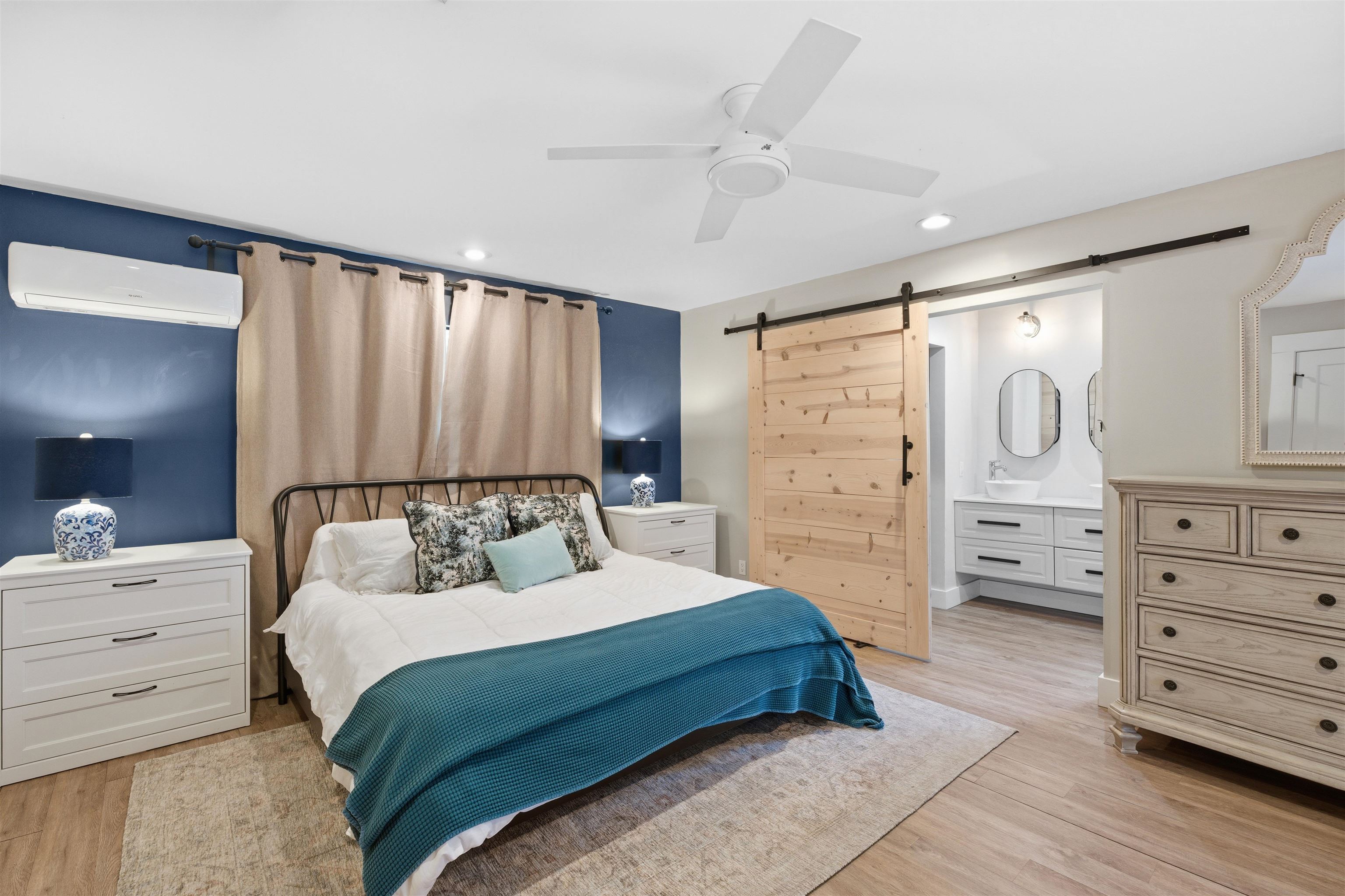 3572 Red Cloud Trail St. Augustine, FL 32086 - Photo 35 of 74 Bedroom with a barn door, a ceiling fan, a wall unit AC, light wood-style floors, and recessed lighting