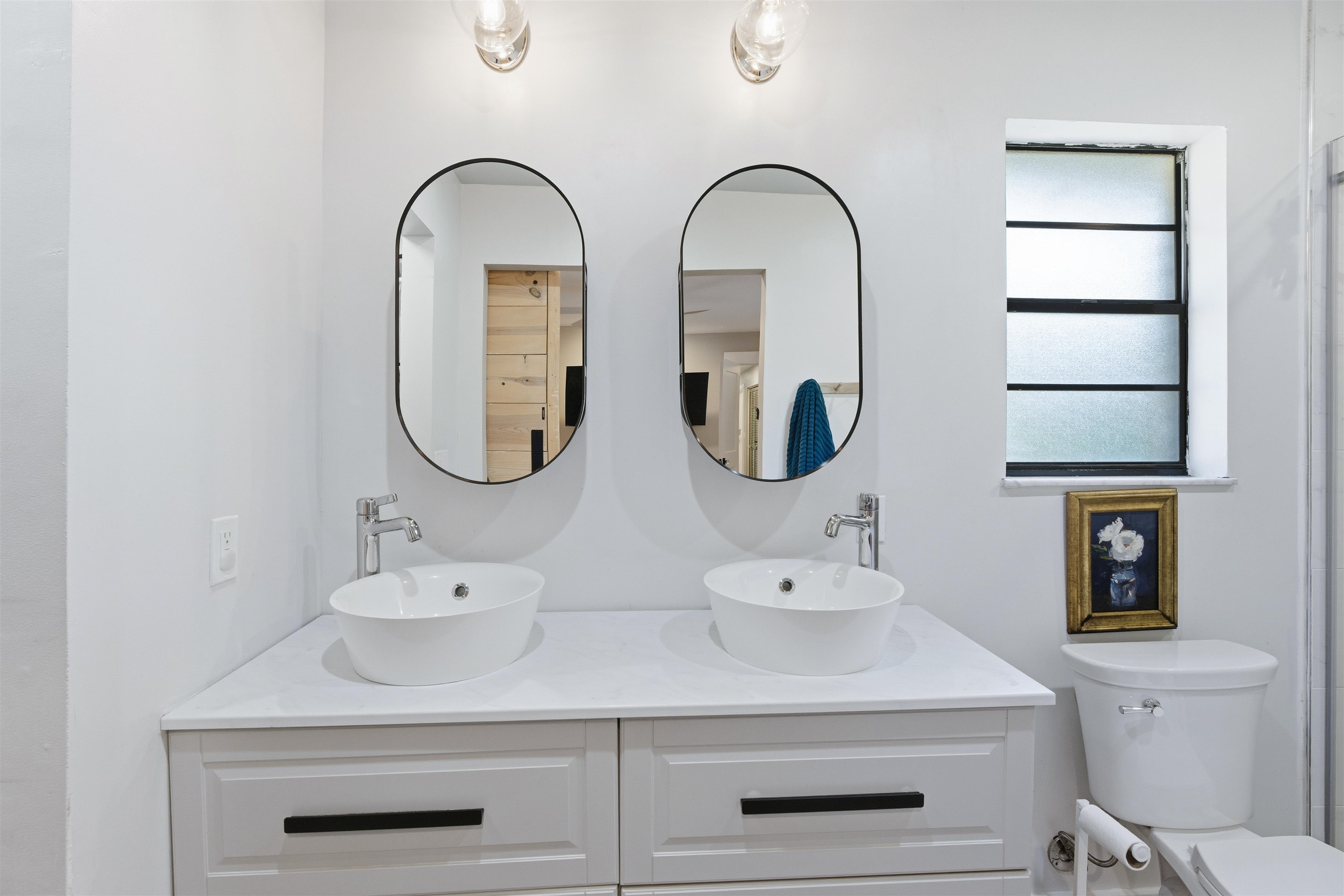 3572 Red Cloud Trail St. Augustine, FL 32086 - Photo 38 of 74 a bathroom with a sink and a mirror