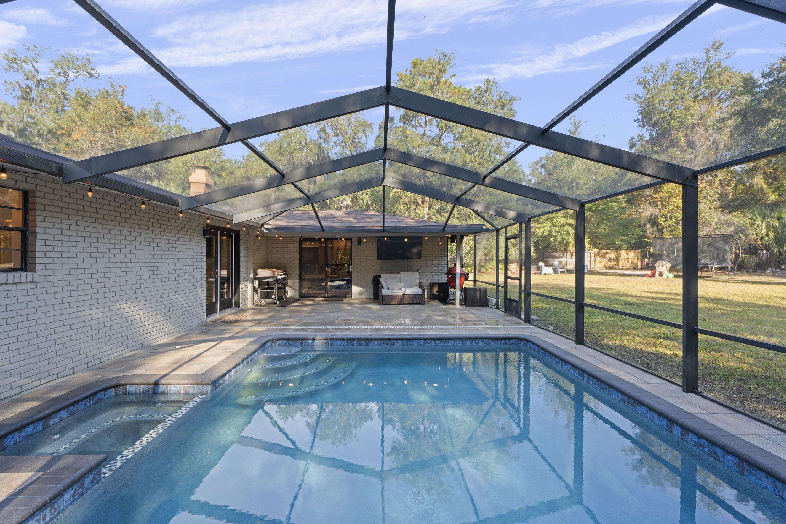 3572 Red Cloud Trail St. Augustine, FL 32086 - Photo 46 of 74 a view of a swimming pool with a patio