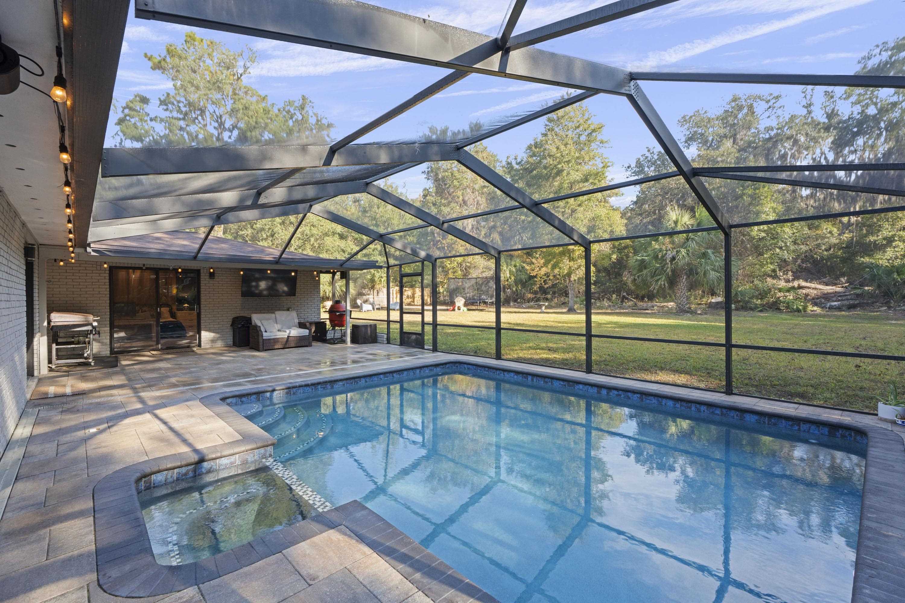 3572 Red Cloud Trail St. Augustine, FL 32086 - Photo 49 of 74 a view of a swimming pool with a porch