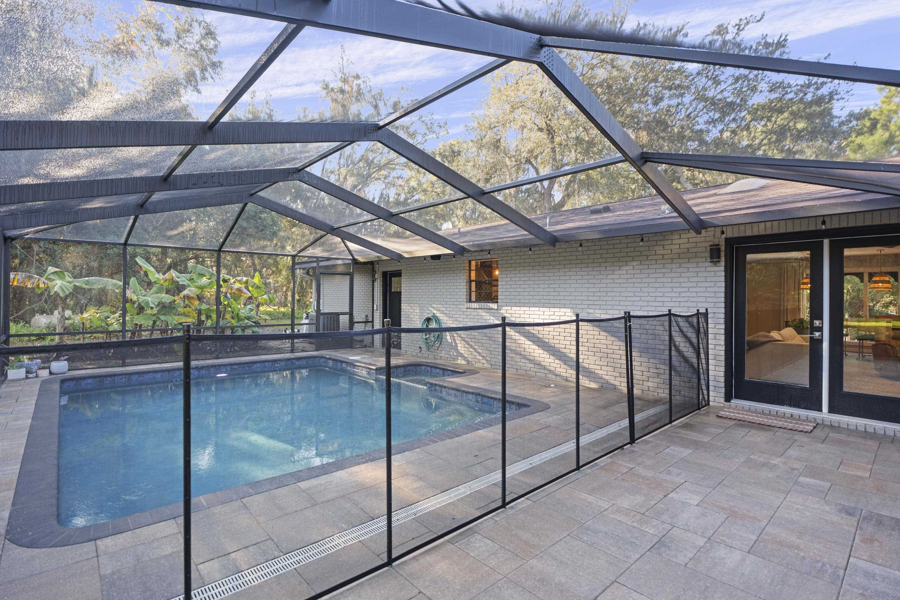 3572 Red Cloud Trail St. Augustine, FL 32086 - Photo 51 of 74 Outdoor pool featuring a lanai, a patio, a sunroom, and a hot tub