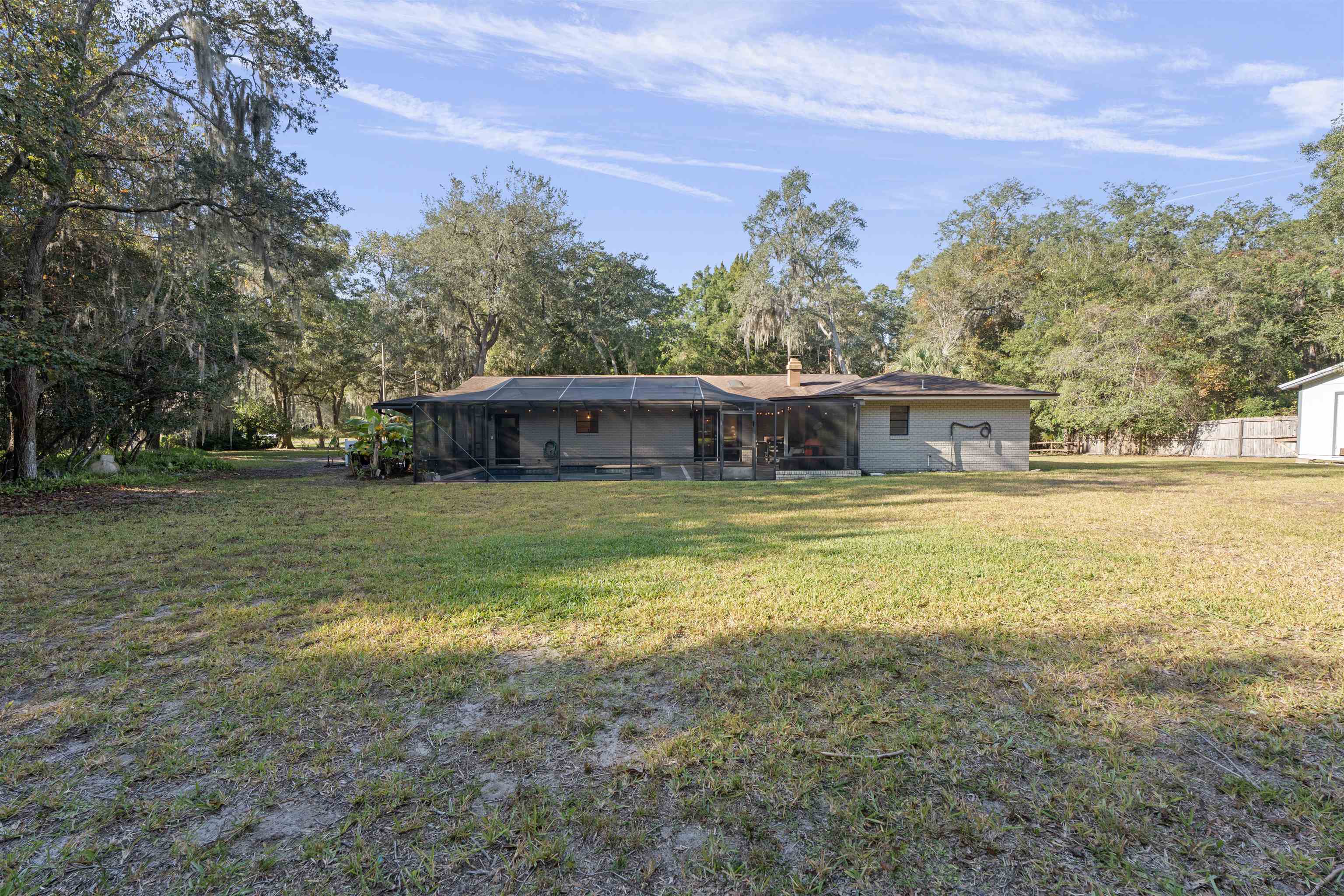 3572 Red Cloud Trail St. Augustine, FL 32086 - Photo 52 of 74 a front view of house with yard and trees in the background