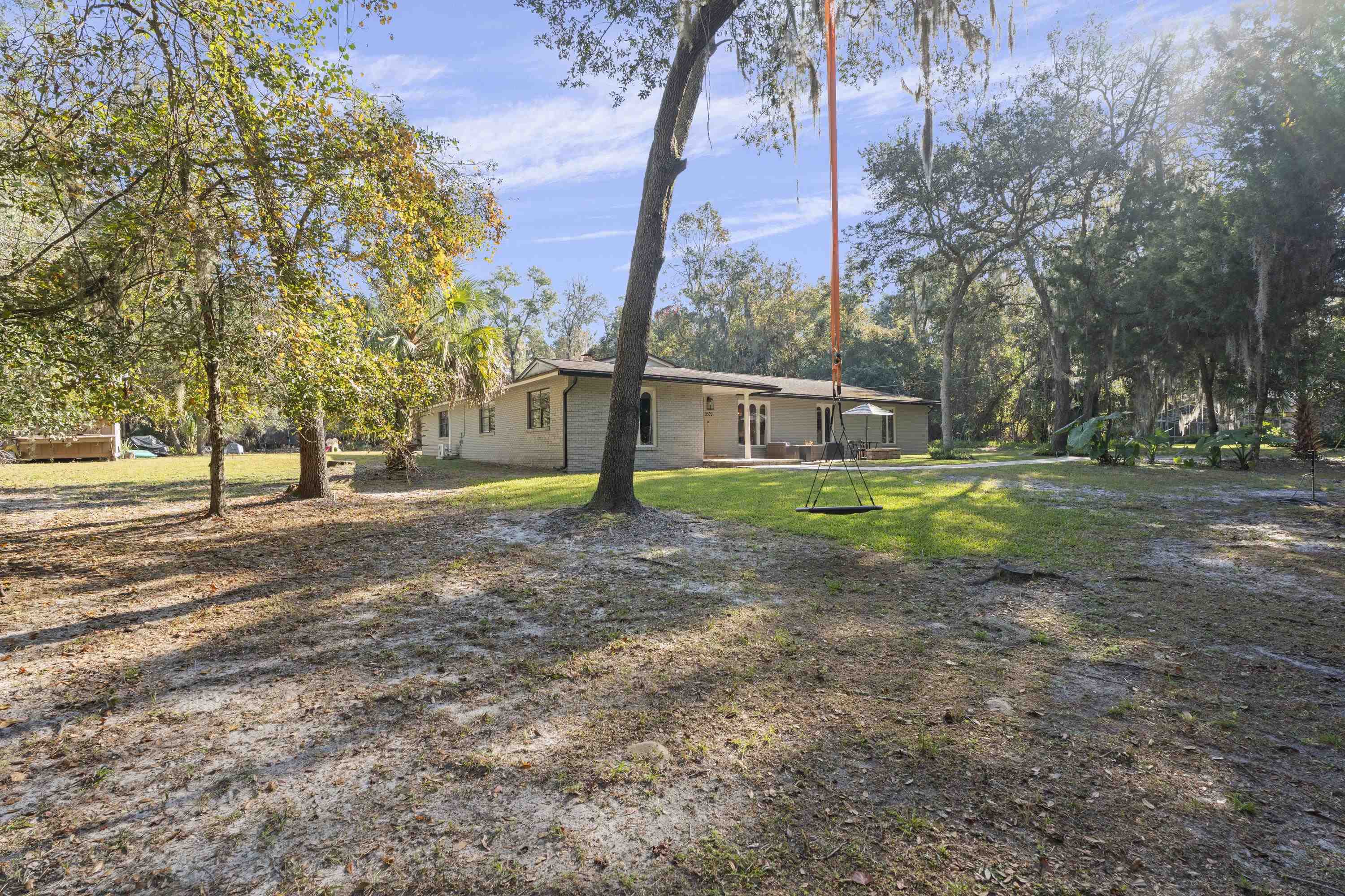 3572 Red Cloud Trail St. Augustine, FL 32086 - Photo 56 of 74 a view of a yard with a tree