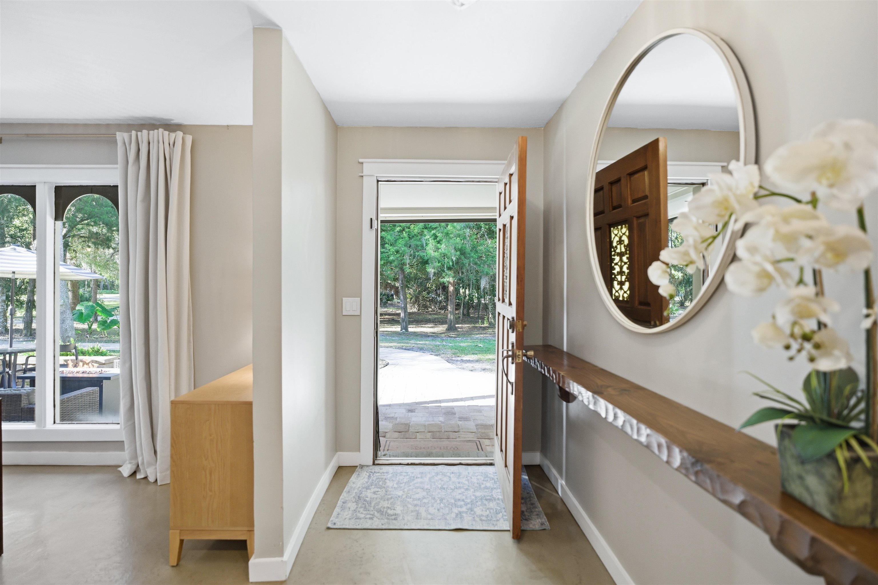 3572 Red Cloud Trail St. Augustine, FL 32086 - Photo 6 of 74 Doorway to outside featuring concrete floors and baseboards